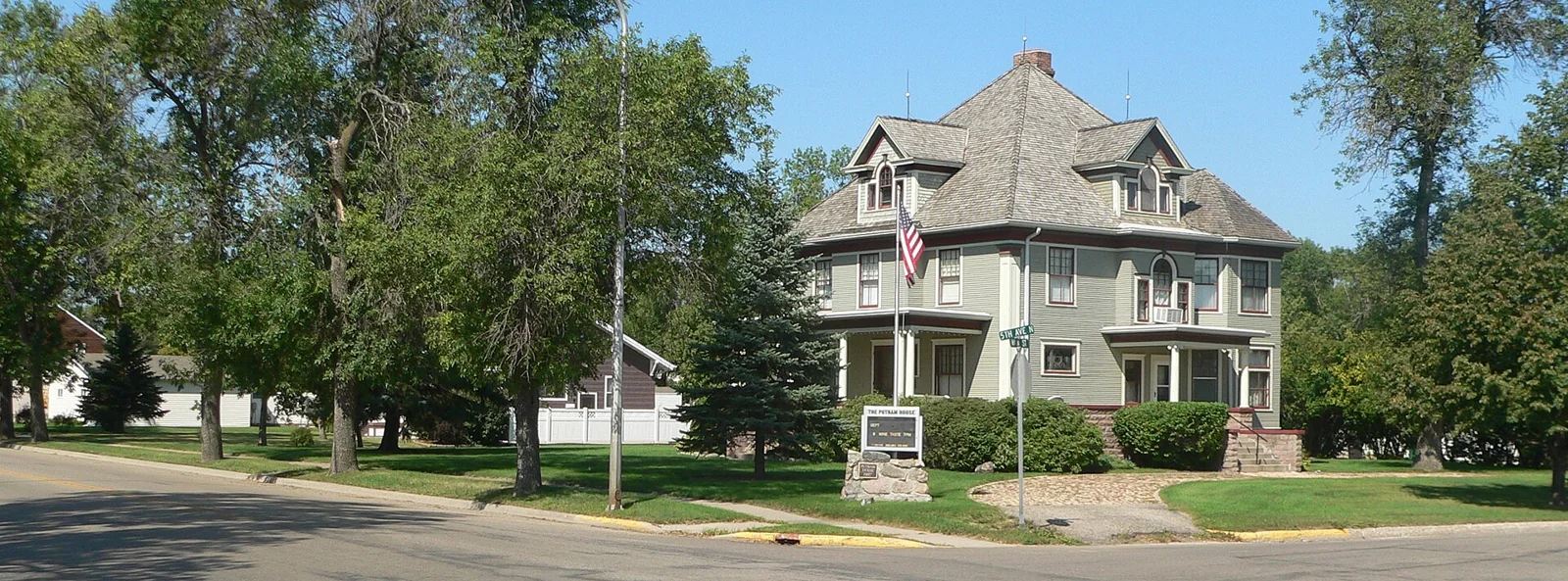 Historic house viewed across an intersection in Carrington, North Dakota